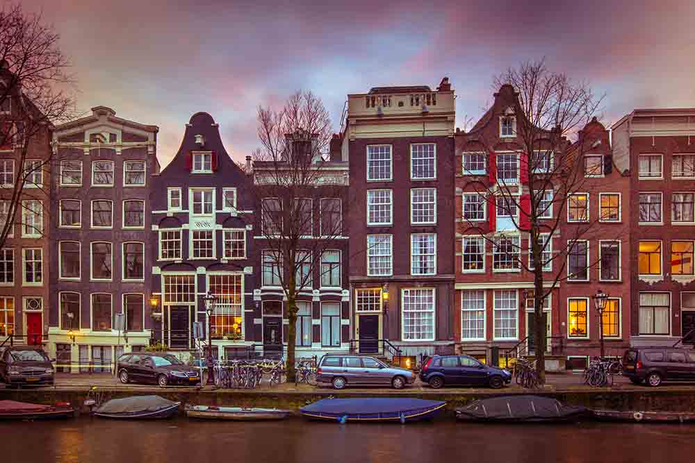 Historic Canal houses on the Brouwersgracht in Amsterdam in vint Amsterdam business travel