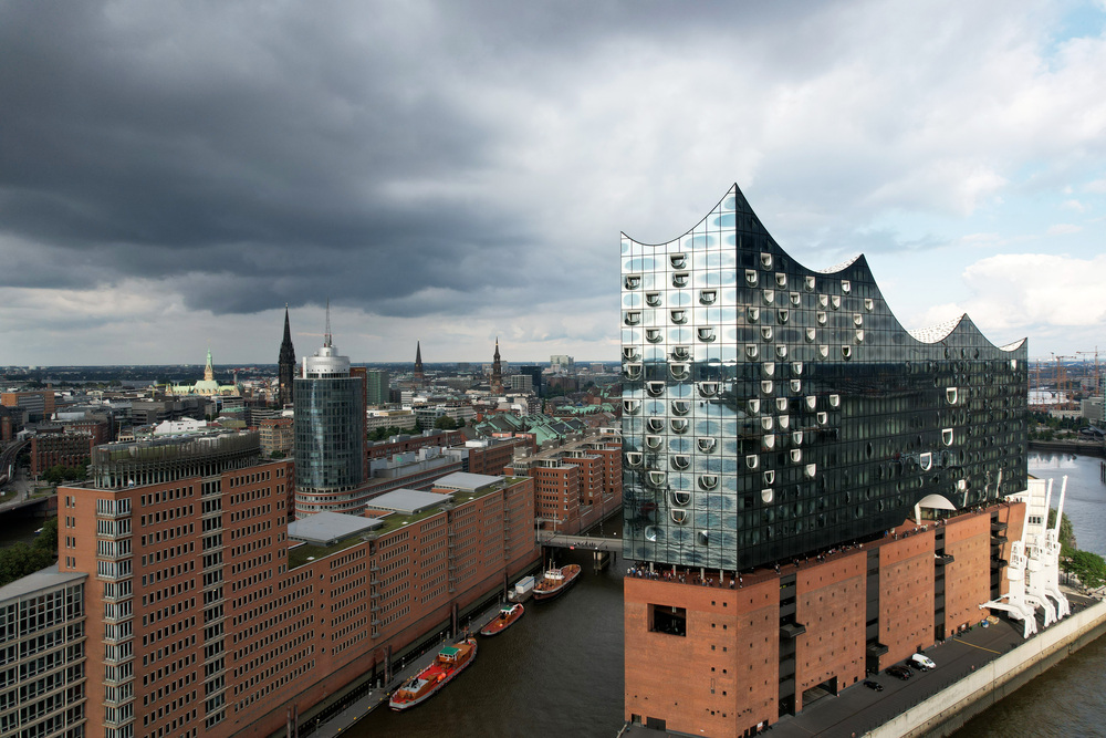 Aerial view of the Elbphilharmonie concert hall on the shore of the Elbe river Aerial view of the Elbphilharmonie concert hall on the shore of the Elbe river in Hamburg